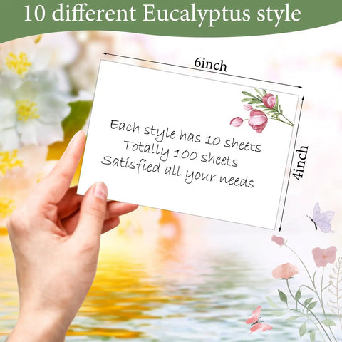 Hand holding 100 Piece Floral Blank Note Cards Set, 4 by 6 Inches, Bulk Notecards with eucalyptus design, text explaining set details.