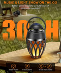 2 Pack Outdoor Bluetooth Speakers With LED Flame Flickers, IP5X Waterproof Lantern Speaker on a table, outdoor setting.