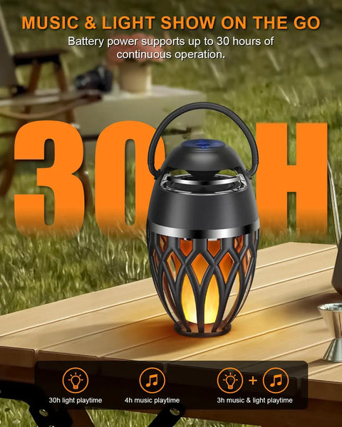 2 Pack Outdoor Bluetooth Speakers With LED Flame Flickers, IP5X Waterproof Lantern Speaker on a table, outdoor setting.