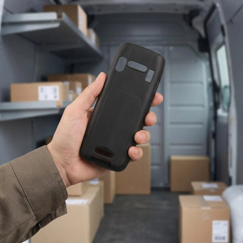 Tough As Nails Nonslip Boot With Crush Proof Armor And Tight Fit For K3S Barcode Scanner held in hand inside a delivery van.