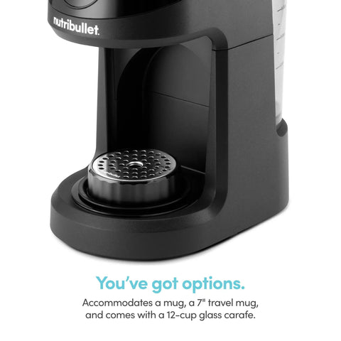 Close-up of Brew Choice Pod And Carafe Coffee Maker, black base, showing brew section for pods or ground coffee.