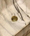 Close-up of Marbling Vessel Sink with gold drain in a rectangular ceramic bowl featuring unique marble pattern design.