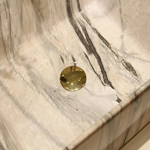 Close-up of Marbling Vessel Sink with gold drain in a rectangular ceramic bowl featuring unique marble pattern design.