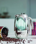 Thermal French Press Coffee Maker 51 Oz Double Wall Stainless Steel Insulated on a countertop with coffee beans.