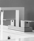Black 4 Inch Centerset Bathroom Faucet With Supply Lines Modern Sink Fixture In SUS304 Stainless Steel Lead Free NSF Certified California CEC Compliant L4150LFF12 BK showing water flow from spout over white sink.