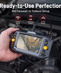 Hand holding Dual Lens Endoscope With Light For Auto HVAC Wall And Home Inspections Mechanic Borescope Camera Flexible Probe.