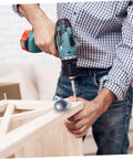 Man installing Heavy Duty Sliding Door Support Wheels With Adjustable Caster Rollers And Precision Bearings on a wooden frame.