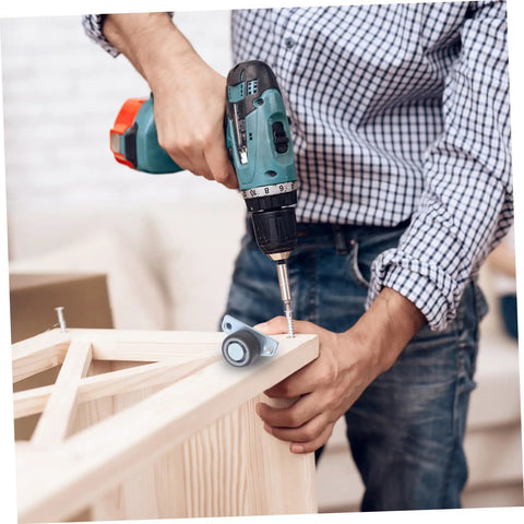 Man installing Heavy Duty Sliding Door Support Wheels With Adjustable Caster Rollers And Precision Bearings on a wooden frame.