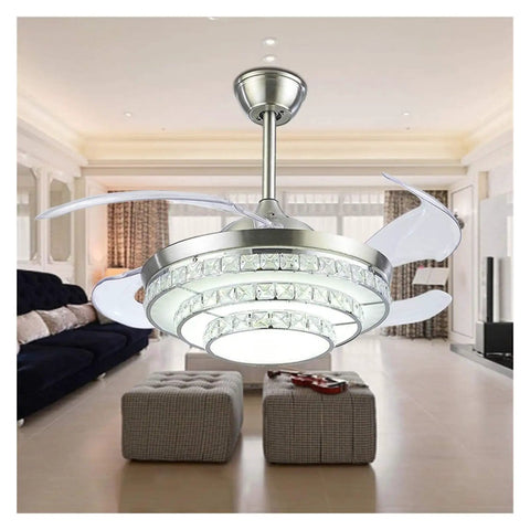 42 Inch Retractable Blade Ceiling Fan Featuring Glowing Crystal Chandelier And Smart Remote Controls For Tunable Led Lights In A Legit Bedroom Or Dope Living Room Vibe in a spacious living room setting.