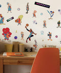 Space Jam LeBron Peel And Stick Giant Wall Decals Set, 21 Dope Reusable Stickers on white wall above wooden desk in room