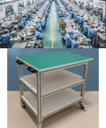 Workhorse Aluminum Anti Static Workbench With Smooth Rolling Locking Casters And Heavy Duty Swivel Brake Wheels for lab use, green top, three shelves.