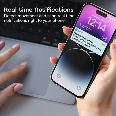 Hand holding smartphone showing notification from 1080P Indoor Security Camera With WiFi For Real Time HD Video, motion detected alert