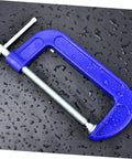 Close-up of 4 Inch Thickened Metal C Clamp With Quick Release For DIYers And Home Improvement Projects on wet surface.