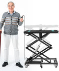 Electric Hydraulic Lift Table Built Dang Tough With Hella Smooth Operation And Straight Up Heavy Duty Aluminum Platform For Mobility Scooters Wheelchairs Tool Cart 110 Lbs Load Capacity Portable Elevator Stand with a smiling man using a remote.