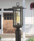 Dusk To Dawn Outdoor Post Light Set, 21-Inch Pier Mount Lantern with Oil Rubbed Bronze finish on Craftsman Style Aluminum Die-Cast shown in garden setting.