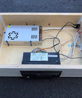 Interior view of a speaker enclosure showcasing Dope Four Pin Four Position Speaker Terminal Blocks With Spring Loaded Push Release Clamp Test Clips For Stereo Speakers Pack Of Four Black Plastic Copper Connectors