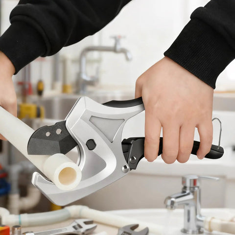Ratcheting PVC Pipe Cutter With Soft Grip Handle in use, cutting 1-5/8 inch PVC pipe, V Shaped SK5 Steel Blade