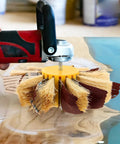 Ultimate Drum Sander Kit For Woodworking Pros features a heavy duty sisal buffing wheel attached to a rotary tool for sanding.