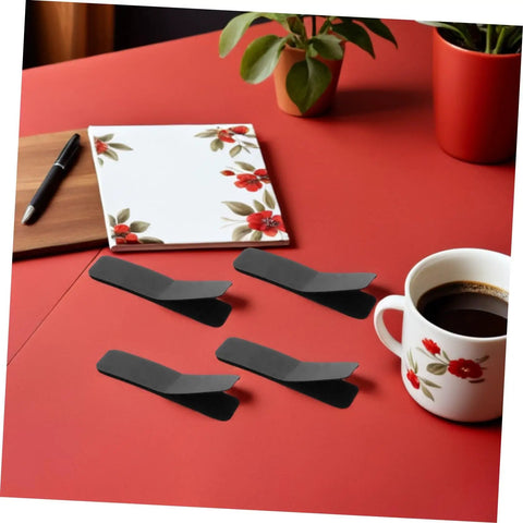 Super Strong Double Sided Hook And Loop Strips 100 Count Black Pet Film Fasteners With Sticky Back on red table with coffee and notebook.