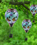 Hot Air Balloon Solar Lantern With Flickering Flame, butterfly pattern glass hanging in garden, 18 inch tall, on tree
