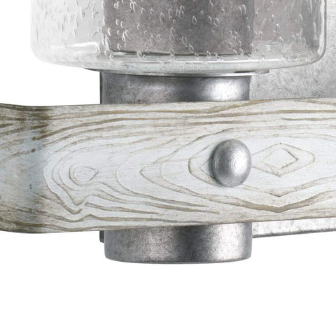 Close-up of wood grain band and clear seeded glass on Gulliver Collection Three Light Clear Seeded Glass Coastal Bath Vanity Light In Galvanized Finish