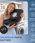 Woman hugging Premium Memory Foam Car Seat Cushion With Napa Leather Ergonomic Lumbar Support Pillow for comfort.
