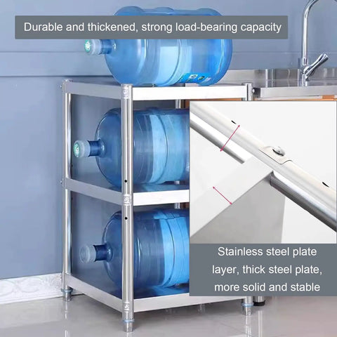 Top Grade Rust Proof Stainless Steel Shelving System With Four Tier Heavy Duty Storage Rack storing large blue water bottles in kitchen.