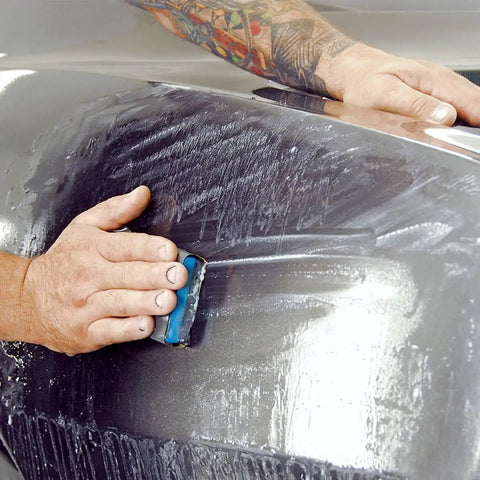 Person using Jhknnk 5pc Premium Dry Wet Sandpaper Set Featuring Tear-Resistant Silicon Carbide Sheets For Metal And Car Paint Sanding.