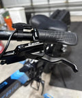 Close-up of handlebar and lever from EBike Hydraulic Disc Brake Set With Power Off Sensor 2 3 Pin Compatibility
