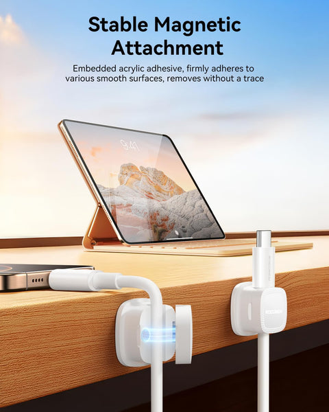 Tablet on desk with Six Pack Magnetic Cable Clips With Smooth Adjustable Adhesive Cord Organizer and magnetic hold in action