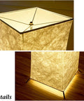 Close-up details of 52 Inch Twist Tower Floor Lamp With Soft Ambient Light, Tyvek fabric shade, base illuminated by RGB LED