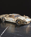 Endurance Racer DIY Model Car Kit 3D Puzzle, Dope Mechanical Wooden Sports Car For Adults To Build One Twelfth Scale, Vintage 1960s Inspired Hobbyist Kit With Real Working Gears, Movable Parts, And Easy To Follow Instructions For First Time Builders. 1:12 wooden race car with number 24