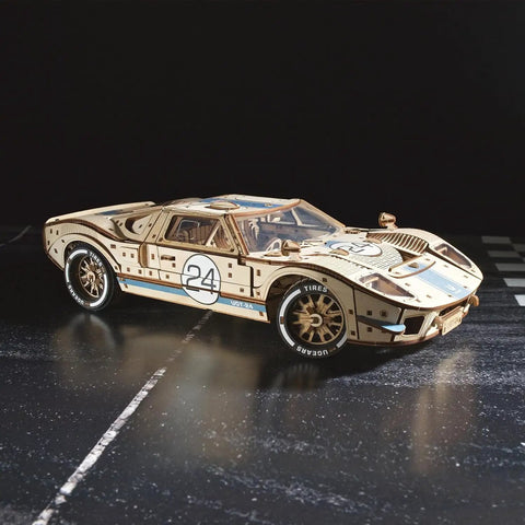 Endurance Racer DIY Model Car Kit 3D Puzzle, Dope Mechanical Wooden Sports Car For Adults To Build One Twelfth Scale, Vintage 1960s Inspired Hobbyist Kit With Real Working Gears, Movable Parts, And Easy To Follow Instructions For First Time Builders. 1:12 wooden race car with number 24