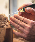 Close-up of hands using Hardcore Tungsten Steel Scribing Chisel Set Featuring Seven Ultra Slick Blades Spanning Point One To Two Millimeters.