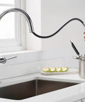 Sellette Single-Handle Pull-Down Kitchen Faucet With Deck Plate In Oil Rubbed Bronze, flexible hose in use near window