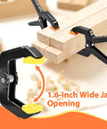 Hella Durable Plastic Spring Clamps 18 Pack 3.5 Inch Black Grip Clips holding wood pieces with 1.6-inch wide jaw opening.