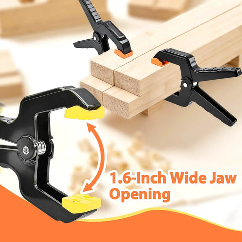 Hella Durable Plastic Spring Clamps 18 Pack 3.5 Inch Black Grip Clips holding wood pieces with 1.6-inch wide jaw opening.