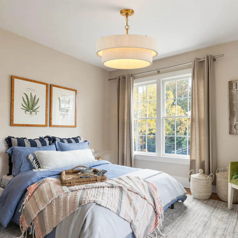 Hand Woven Rattan Chandelier Serving Real Boho Vibes And Adjustable Coastal Design hanging above a cozy bedroom with light bedding.