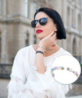 Woman wearing bracelet with 120 Pcs Memory Wire End Caps Set In Stainless Steel, Half Drilled Cord End Beads 3mm 4mm 5mm
