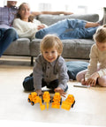 Child playing with 4 Pack Adorable Construction Truck Set With Realistic Front End Loader Models for imaginative play indoors.
