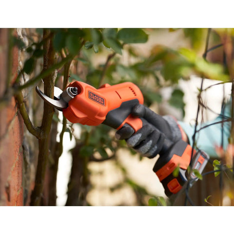 Premium 18V Cordless Hand Grass Trimmer With 2Ah Lithium Battery cutting through branches, ergonomic and powerful tool for landscaping.
