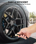 Hand using 12 Inch Tire Inflator Extension Hose with Clip On Air Chuck Adapter for quick inflation on a car wheel.