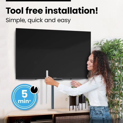 Woman using Wall Cable Hider Kit conceals up to 153 inches of wires with easy adhesive install no tools needed, under TV