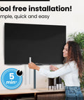 Woman installing Massive 306 Inch Cable Hider Kit For Wall Cords And TV Setup, tool-free, in living room