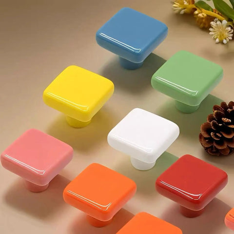 1.25 Inch Glossy Ceramic Square Cabinet Knobs White 6 Pcs Easy Install Drawer Pull Handles displayed with colorful knob assortment