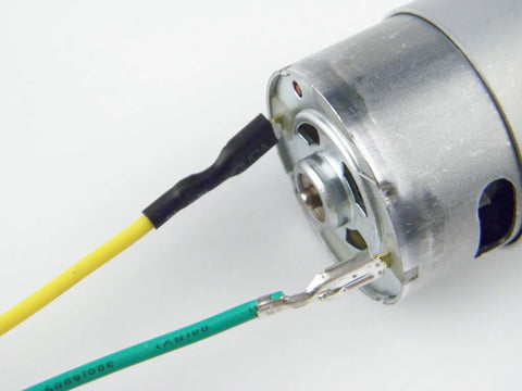 Close-up view of High-Performance 550 12V DC Ride-On Car Motor Set For Kids 12000 RPM CW CCW with wiring detail