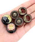 Six Piece Ear Plugs Set Sun Moon Natural Wood And Acrylic Tunnels Expander Plugs For Piercing Includes 8Mm size displayed on hand