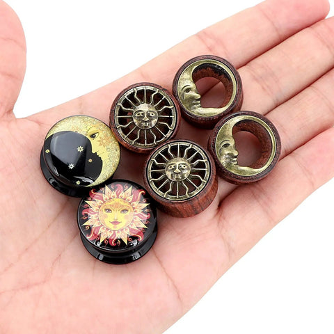 Six Piece Ear Plugs Set Sun Moon Natural Wood And Acrylic Tunnels Expander Plugs For Piercing Includes 8Mm size displayed on hand
