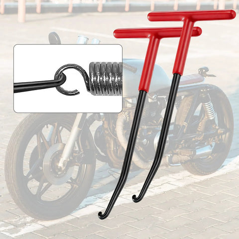 Two red T-shaped exhaust spring pullers with curved hooks for motorcycle exhaust spring removal