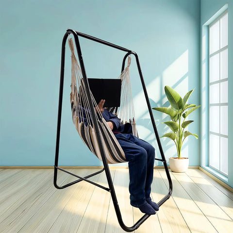 Weatherproof Hammock Chair Stand With Hanging Swing Chair Included, Rugged Iron Frame Supports Up To 450 Lbs in a sunny room